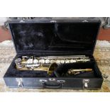 A VINTAGE CASED 'BEACON' SAXOPHONE With brass finish, mother of pearl buttons and separate