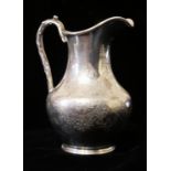 GOLDSMITHS ALLIANCE, A VICTORIAN SILVER CREAM JUG Having a branch form handle and fine engraved