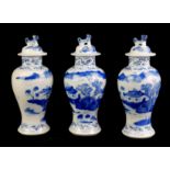 THREE 19TH CENTURY CHINESE BLUE AND WHITE VASES AND COVERS Decorated with landscapes, bearing Kangxi