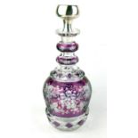 A CONTINENTAL SILVER AND BOHEMIAN GLASS DECANTER The circular stopper bearing an engraved monogram