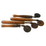 A COLLECTION OF FOUR PINE AND BRONZE LEATHER PATTERN MAKING TOOLS Each wheel edged with a pattern,