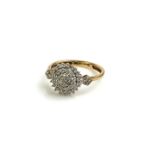 A 9CT GOLD AND DIAMOND CLUSTER RING The arrangement of pave set diamonds with diamonds to