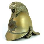 AN EARLY 20TH CENTURY BRASS 'MERRYWEATHER' FIREMAN'S HELMET Having cast dragons to finial and the