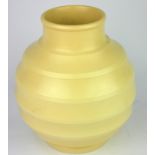 KEITH MURRAY FOR WEDGWOOD, AN ART DECO LARGE YELLOW GLAZED POTTERY GLOBULAR VASE Stepped form,