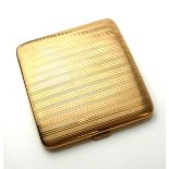 ASPREY, AN EARLY 20TH CENTURY 9CT GOLD CURVED RECTANGULAR CIGARETTE CASE With engine turned engraved