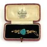 A VICTORIAN YELLOW METAL, TURQUOISE AND SEED PEARL BROOCH The arrangement of turquoise stones in a
