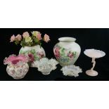 A COLLECTION OF SIX OVER PAINTED GLASS VASES With floral decoration, along with a figural