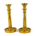 A PAIR OF FINE LATE 19TH CENTURY CONTINENTAL BRONZE AND PARCEL GILT DESK CANDLESTICKS Neoclassical