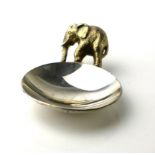 STUART DEVLIN, A VINTAGE SILVER GILT 'ELEPHANT' CADDY SPOON Standing elephant handle on a plain