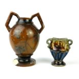 AN EARLY MARTIN BROTHERS STONEWARE ARCH FORM TWIN HANDLED VASE Exceptionally carved to one side with