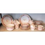 ROYAL DOULTON, AN EDWARDIAN BONE CHINA TEA SERVICE FOR TEN Decorated with English rose, enriched