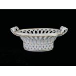 AN 18TH CENTURY CONTINENTAL HARD PASTE PORCELAIN SNAKE FORM TWIN HANDLED OVAL BASKET With openwork