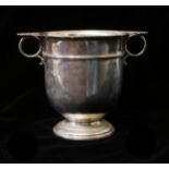 AN EARLY 20TH CENTURY SILVER TWIN HANDLED CUP With twin loop handles, silver gilt interior and