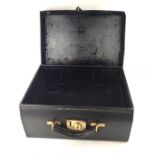 MAPPIN AND WEBB, FACING THE MANSION HOUSE, LONDON, A VINTAGE BLACK LEATHER CASE With partially