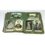 A LATE 19TH EARLY 20TH CENTURY TOOLED LEATHER POSTCARD ALBUM Containing theatrical portraits and