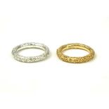 AN 18CT GOLD BARK EFFECT BAND Along with its pair in silver (size Q/N). Condition: good