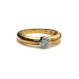 A VINTAGE 9CT GOLD AND DIAMOND SOLITAIRE RING The single round cut diamond in a collet mount (size