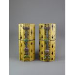 A PAIR OF TALL CYLINDRICAL YELLOW BISCUIT 'BAMBOO' HAT STANDS, CIRCA 1900 Each carved and painted as