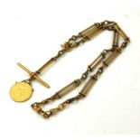 A VICTORIAN 18CT GOLD ALBERT WATCH CHAIN Having a T bar and pierced links, set with a South Africa