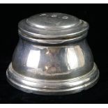 AN EDWARDIAN SILVER SPHERICAL INKWELL The hinged lid engraved with monogram initials and bakelite