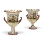 A PAIR OF 19TH CENTURY ITALIAN PORCELAIN CAMPANA FORM VASES With two loop handles, knopped stems and