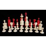 A 19TH CENTURY INDIAN IVORY CHESS SET Sixteen pieces stained red and sixteen natural ivory with