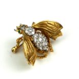 AN 18CT GOLD AND DIAMOND INSECT BROOCH Set with round cut diamonds and emerald eyes with engraved