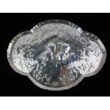 WILLIAM COMYNS, A VICTORIAN SILVER TRINKET TRAY Scalloped edge with embossed decoration of cherubs