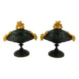 A PAIR OF BRONZE ORMOLU TAZZA DISHES Classical form with floral ormolu finial and twin handles,