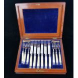 A SET VICTORIAN SILVER AND IVORY FRUIT KNIVES AND FORKS Comprising twenty-three matching knives