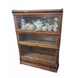 GLOBE WERNICKE, AN EARLY 20TH CENTURY MAHOGANY FOUR SECTION BOOKCASE Including base drawer. (86cm