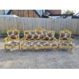A FRENCH DESIGN GILTWOOD FRAMED THREE PIECE SUITE Comprising a three seat settee and two