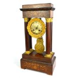 A 19TH CENTURY FRENCH WALNUT AND MARQUETRY INLAID PORTICO CLOCK With surround brass circular dial