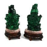 A PAIR OF CHINESE MALACHITE AND ROSE QUARTZ VASES AND COVERS Carved in high relief with lion finials