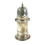 A VICTORIAN SILVER CYLINDRICAL CASTER With pierced dome lid, hallmarked C.S. Harris and Sons,