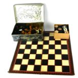 A COLLECTION OF EARLY 20TH CENTURY WOODEN CHESS AND DRAUGHTS GAMING PIECES A Staunton chess set (one