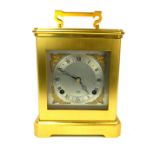 ELLIOTT OF LONDON, A LARGE GILT BRONZE CASED CHIMING CARRIAGE CLOCK Complete with key. (17cm x 21cm)