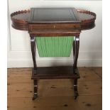 A REGENCY PERIOD ROSEWOOD LADIES' WRITING/WORK/GAMES TABLE The maroon tooled leather adjustable
