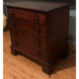 A 19TH CENTURY MAHOGANY CHEST OF FOUR LONG DRAWERS Of small proportions, fitted with turned wooden