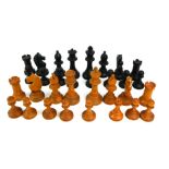 A STAUNTON STYLE BOXWOOD AND STAINED EBONY COMPLETE CHESS SET Standard size, in a later 20th Century