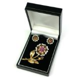 A VINTAGE YELLOW METAL, DIAMOND, RUBY AND PEARL BROOCH AND EARRINGS SET A floral bouquet set with