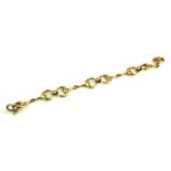 A VINTAGE 9CT GOLD BRACELET Having oval pierced links and shaped spacer links. (approx 18cm)