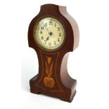 AN ART NOUVEAU MAHOGANY BOUDOIR CLOCK The carved case inlaid with a single flower, having a circular