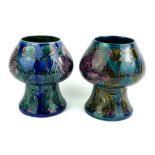A PAIR OF ORGANIC FORM VASES Elaborately tubeline decorated in low relief, with palette of flowering