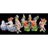 A SET OF SIX MODERN JAPANESE PORCELAIN MODELS OF EXOTIC AMAZONIAN PARROTS, CIRCA 1986 Painted in