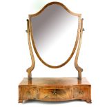 A 19TH CENTURY MAHOGANY TOILET MIRROR With shield shaped above three serpentine shaped trinket