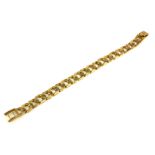 A VINTAGE 9CT GOLD CURB LINK BRACELET Having pierced links with textured bark effect. (approx 20cm)