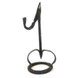 A SUBSTANTIAL ANTIQUE WROUGHT IRON RUSHLIGHT Square column, two splayed legs, on circular base,