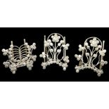 A SET OF THREE CONTINENTAL SILVER MENU HOLDERS Fine wirework with embossed textured roundels forming