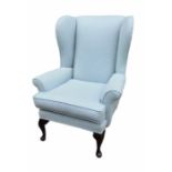 TWO 19TH CENTURY DESIGN WING ARMCHAIR In pale blue fabric upholstery, on cabriole legs. (78cm x 83cm